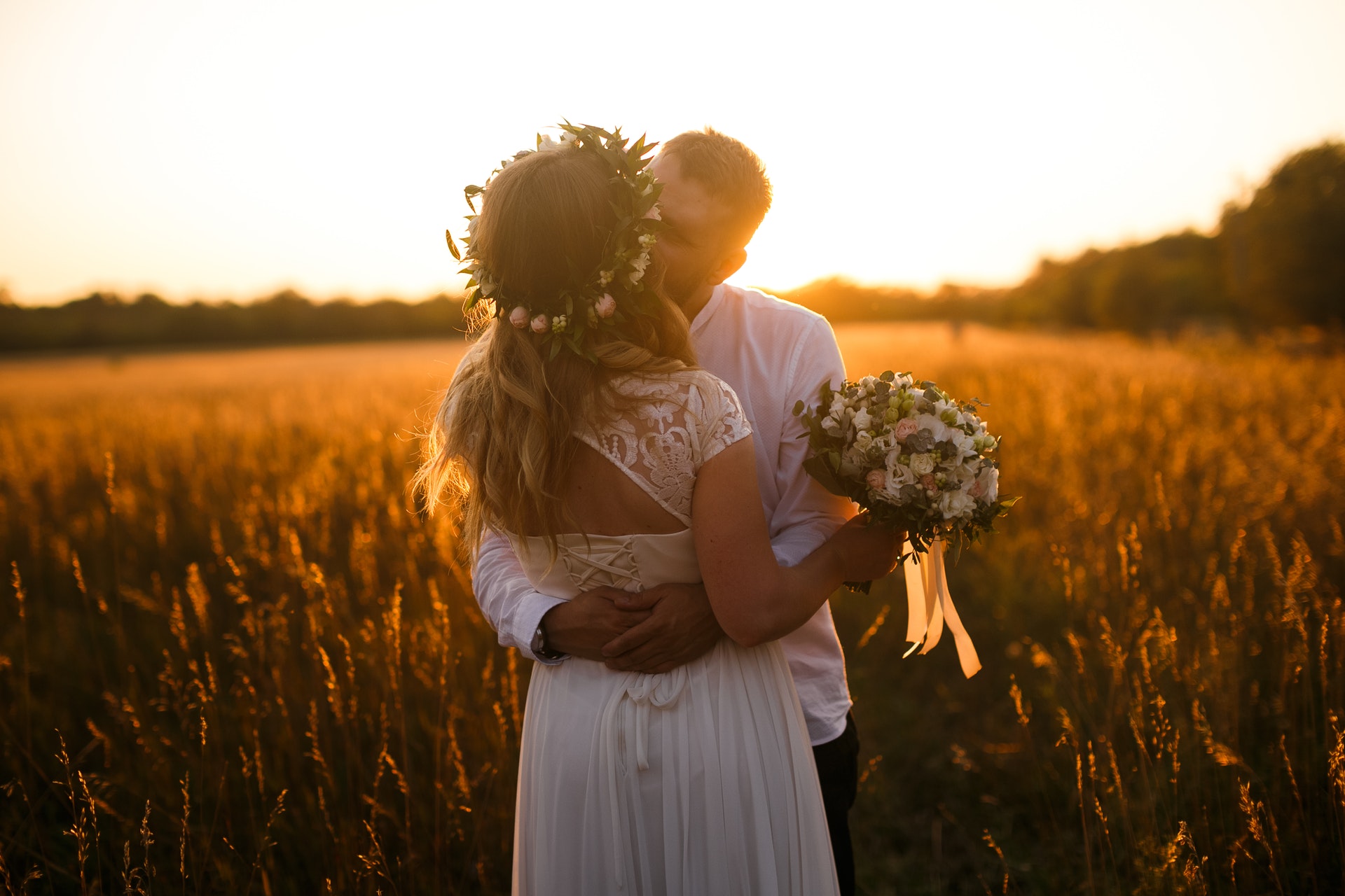 bride and groom kiss
