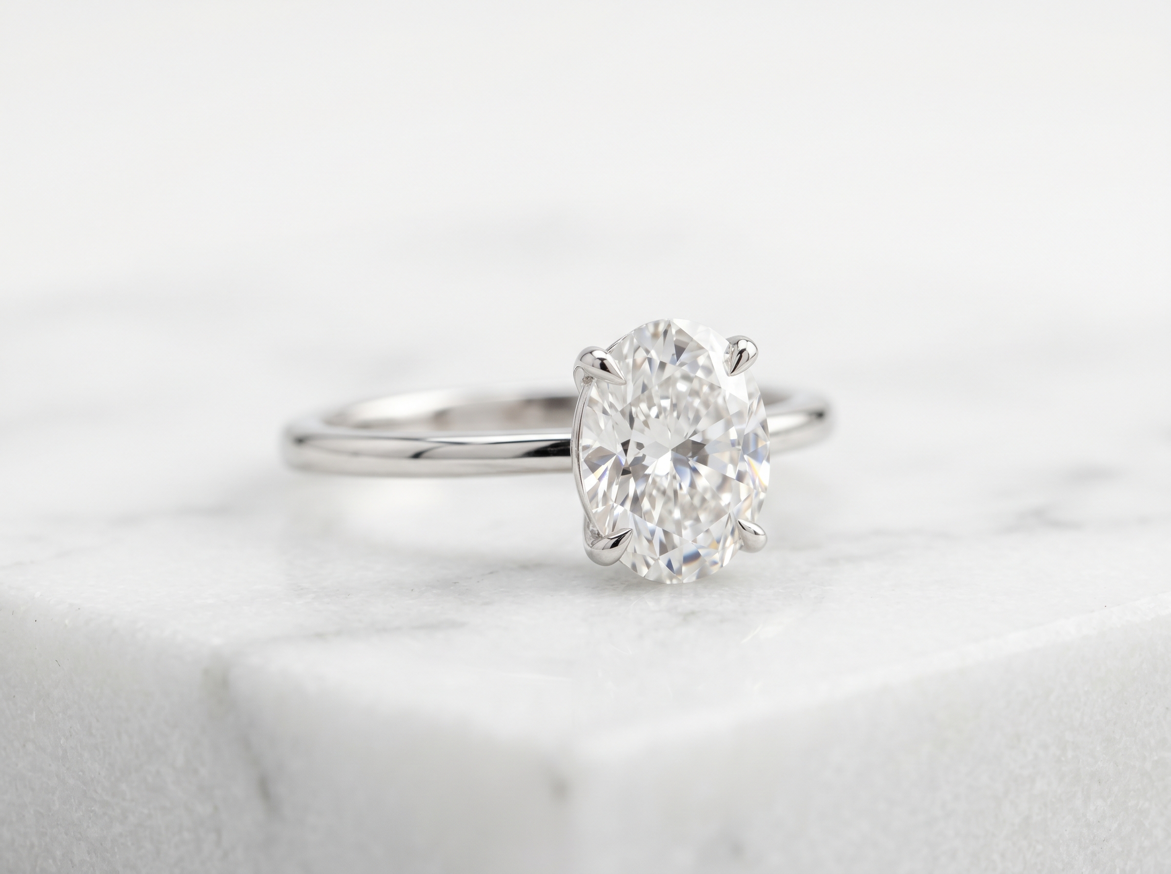 0.9-carat oval lab grown diamond engagement ring in white gold — what a $1,000 budget buys in 2026